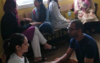 People meditating with ThetaHealing in Karachi Wellness Festival session conducted by ThetaHealer Sana Naseem