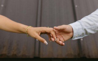 A couple's hand showing Karmic relationships