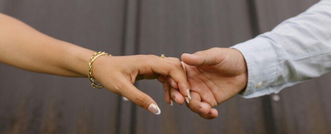 A couple's hand showing Karmic relationships