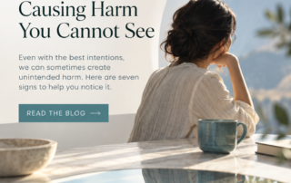 A clean, modern blog cover for Quanta Miind in a cool cream, teal, and pale blue palette. The design shows a thoughtful woman sitting near a bright window with soft mountain views in the background, her reflection visible in a glossy water-like surface below. Large text reads “Seven Signs You Might Be Causing Harm You Cannot See,” with supporting copy inviting readers to notice unintended harm. The layout includes Quanta Miind branding at the top, a “Read the Blog” button, and the website www.quantamind.net at the bottom.